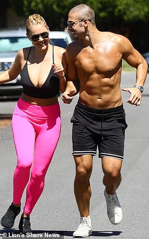 Masks off: The duo didn't wear their face masks for the outing, but they carried them while they jogged