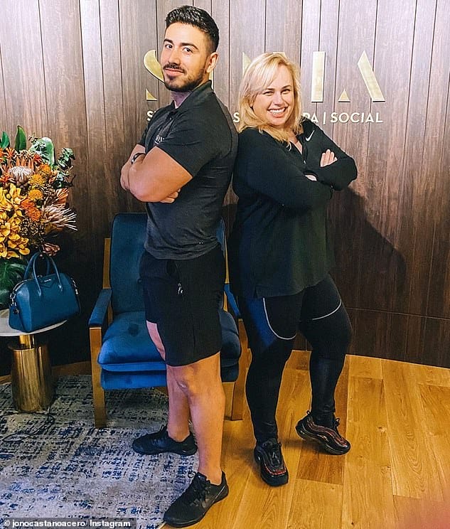 Keeping fit: Rebel's personal trainer Jono Castano Acero (left) recently shared her workout routine with E! Australia. During a typical week, she does a combination of HIIT workouts, mobility, weights and resistance, and has just one day per week of rest
