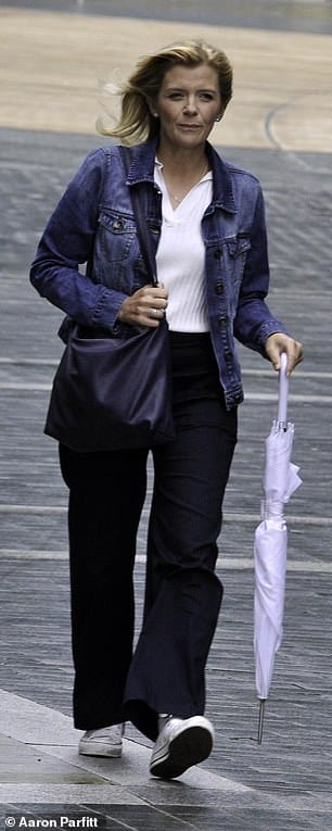 Low-key look: Sporting a casual ensemble, she wore a denim jacket worn over a white v-neck top