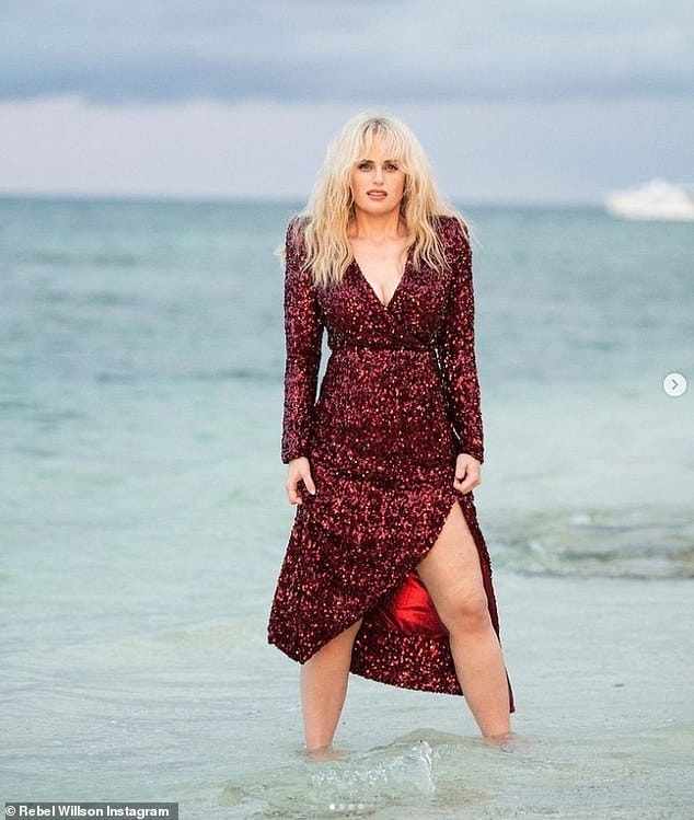 Wow! Rebel Wilson showed off her incredible 77lbs weight loss in a sparkly red dress as she celebrated Thanksgiving with beach photoshoot in Fiji on Thursday