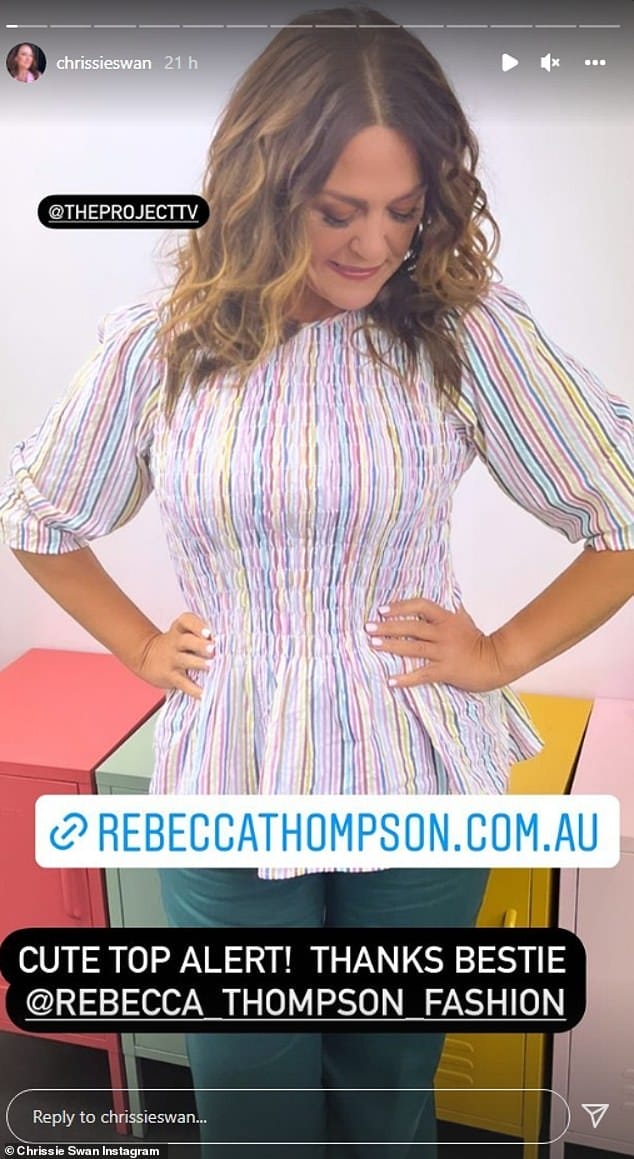 How pretty! The figure-hugging shirt cinched in at Chrissie's waist, and also featured mid-length sleeves and a high neckline