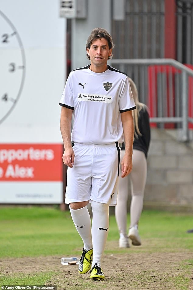 Sporty: The 34-year-old, who has lost an astonishing 14 stone, exhibited his slim frame in a white football shirt and matching shorts, with a pair of white football socks and bright yellow trainers