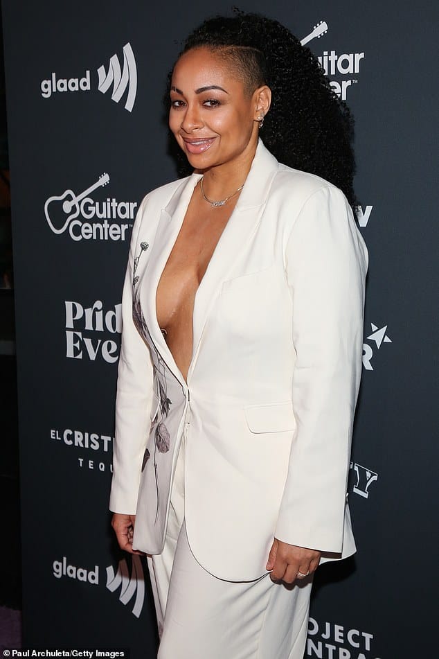 Suited: Raven-Symoné's white suit, featuring a floral design down the right side, was selected by stylist Jason Sky