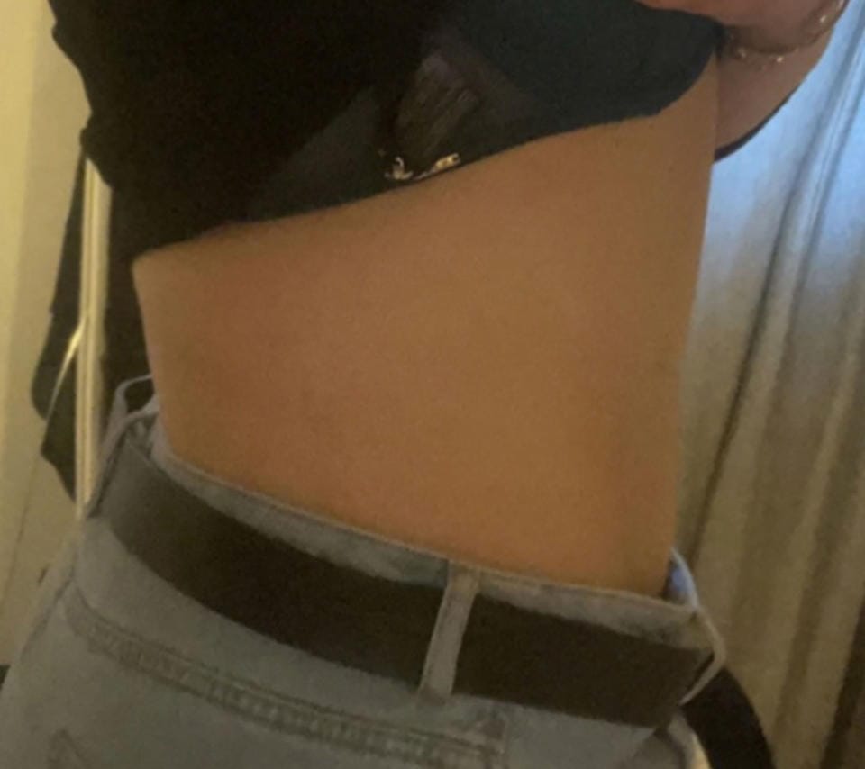 Azizi says a combination of weigh training and restricting calories has seen her lost almost 9st in weight. (Aida Azizi/Caters)